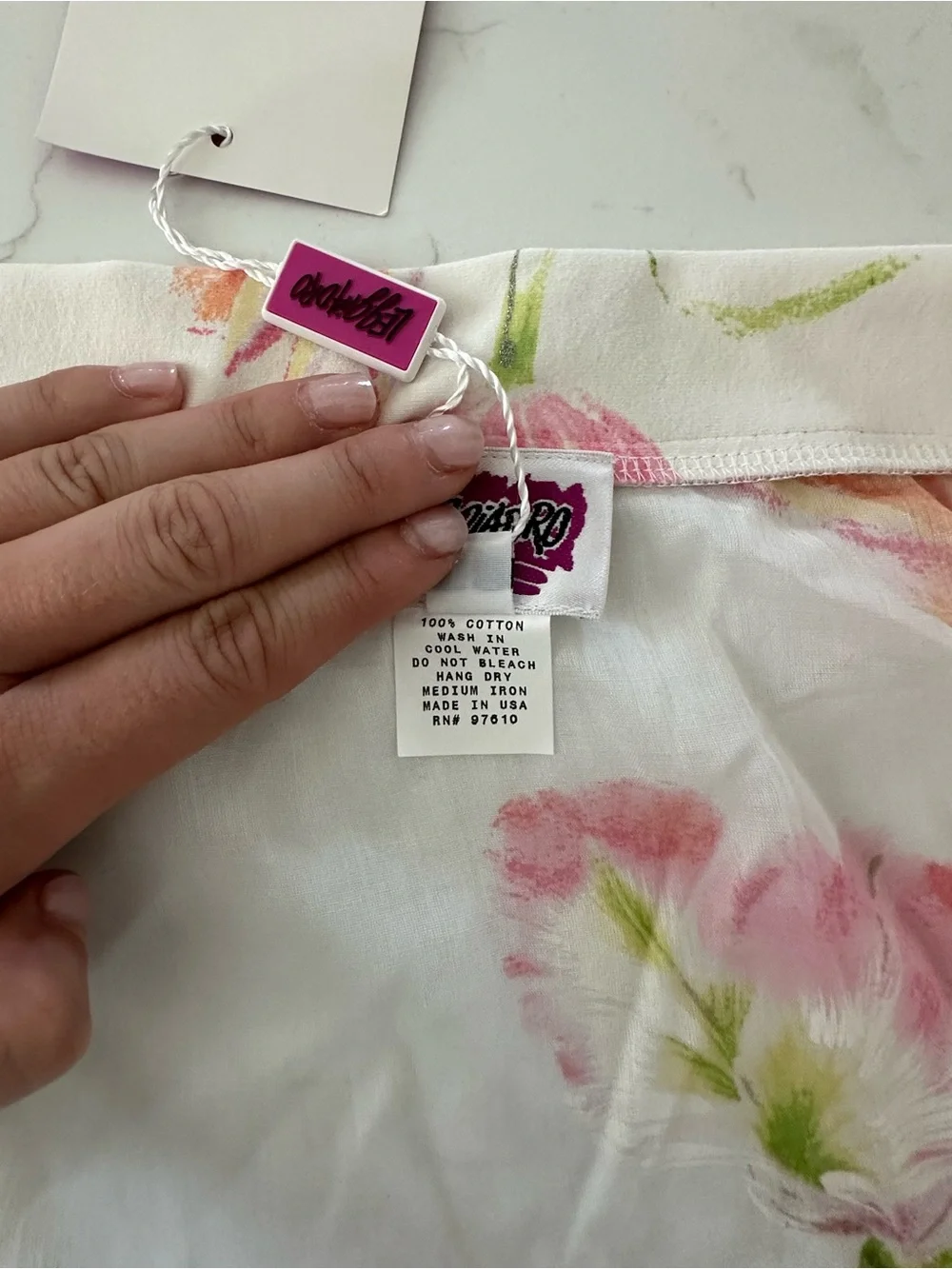 Leggiadro White Floral Tie-Wrap Mini Skirt with Pink & Green Accents
